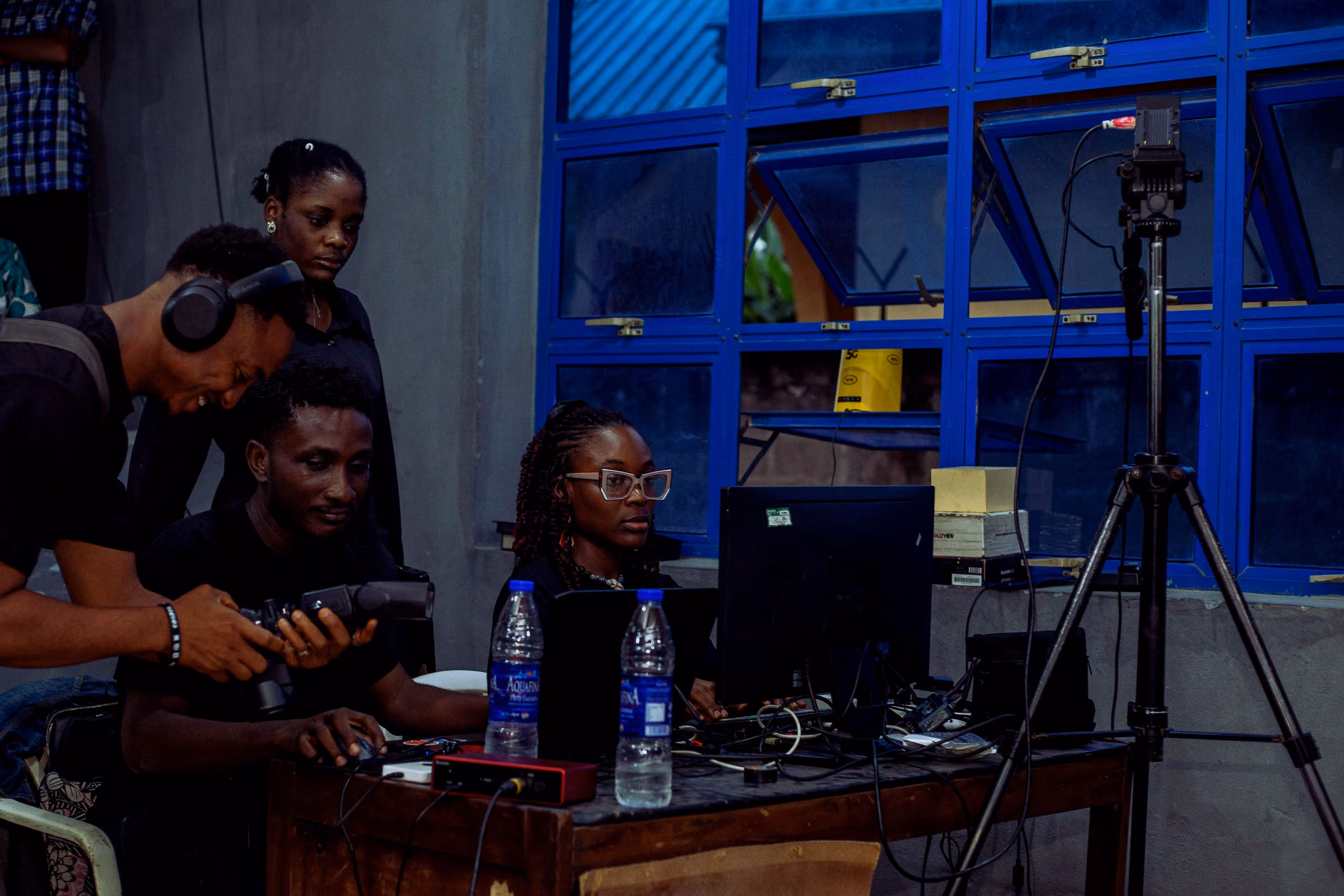 Production desk with laptops and monitors during a worship service